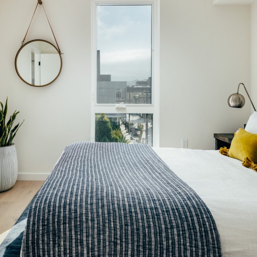 Bedroom with natural lighting and high ceilings Bedroom with natural lighting and high ceilings