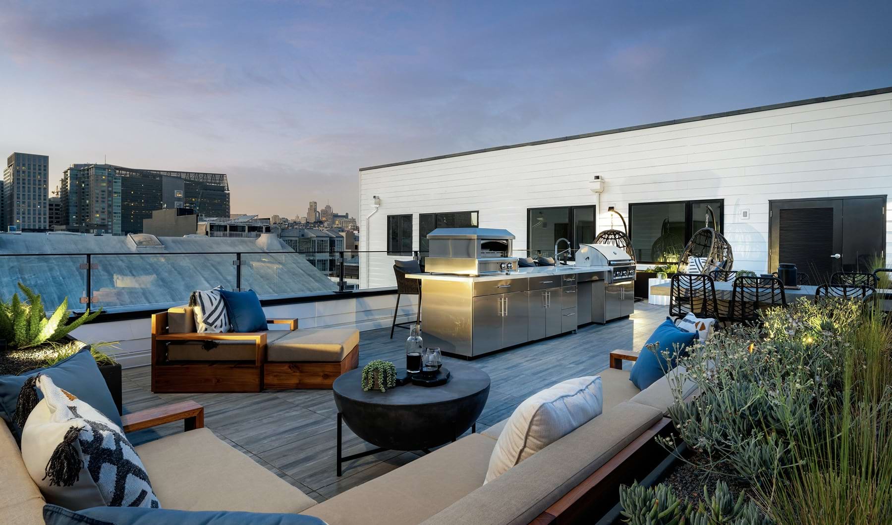 Rooftop lounge with skyline view Rooftop lounge with skyline view